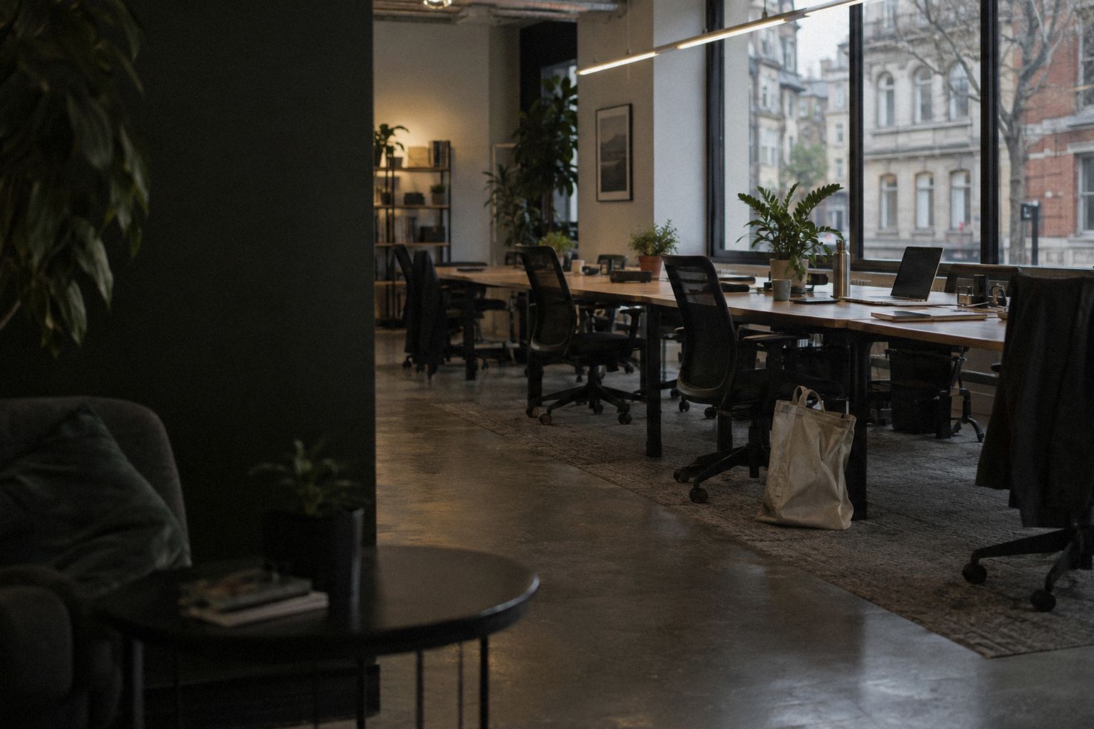 A co-working space at 5pm on a Friday, most chairs already pushed in.