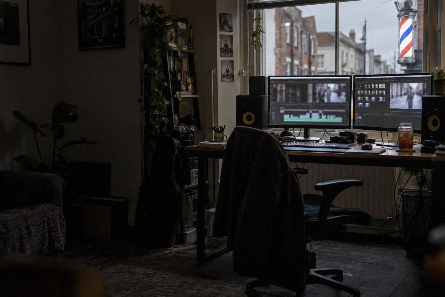 An edit suite above a barber's in the evening, a video timeline on screen.