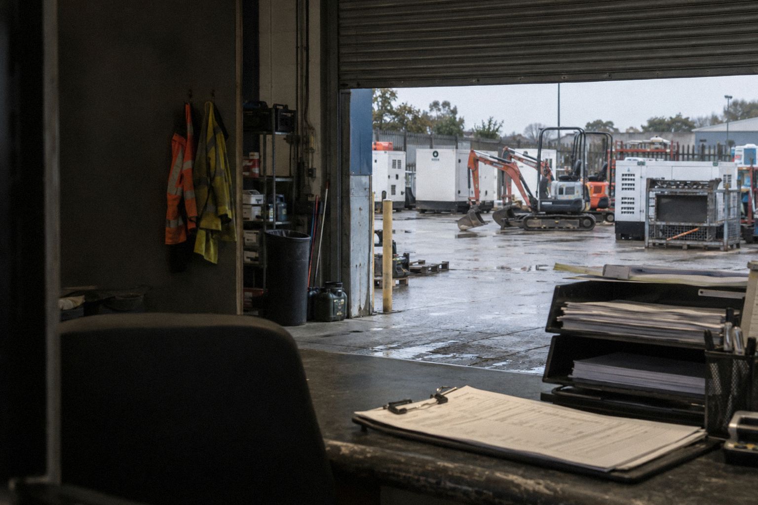 An equipment-hire depot at 7.30am, the roller door rising on the yard.