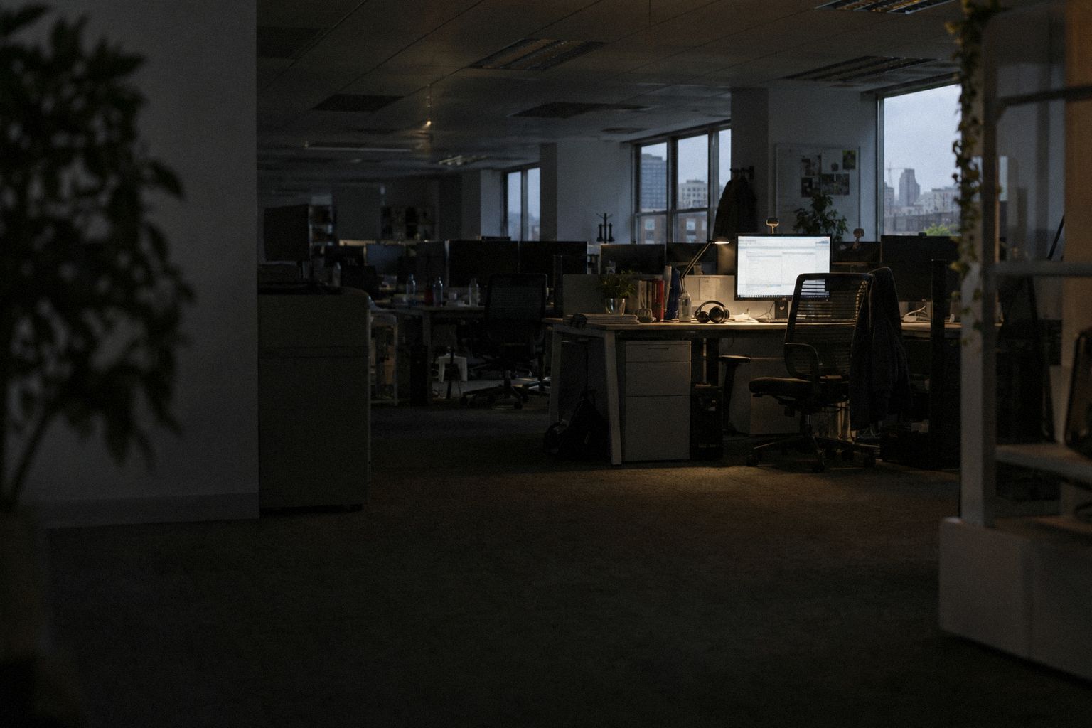 A recruitment office at 5.40pm on a Friday, half the lights already off.